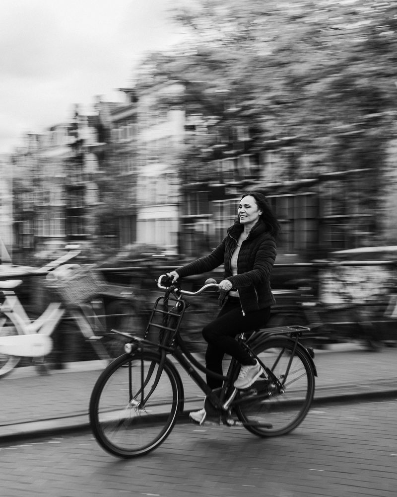 Hadewij cycling along an Amsterdam canal